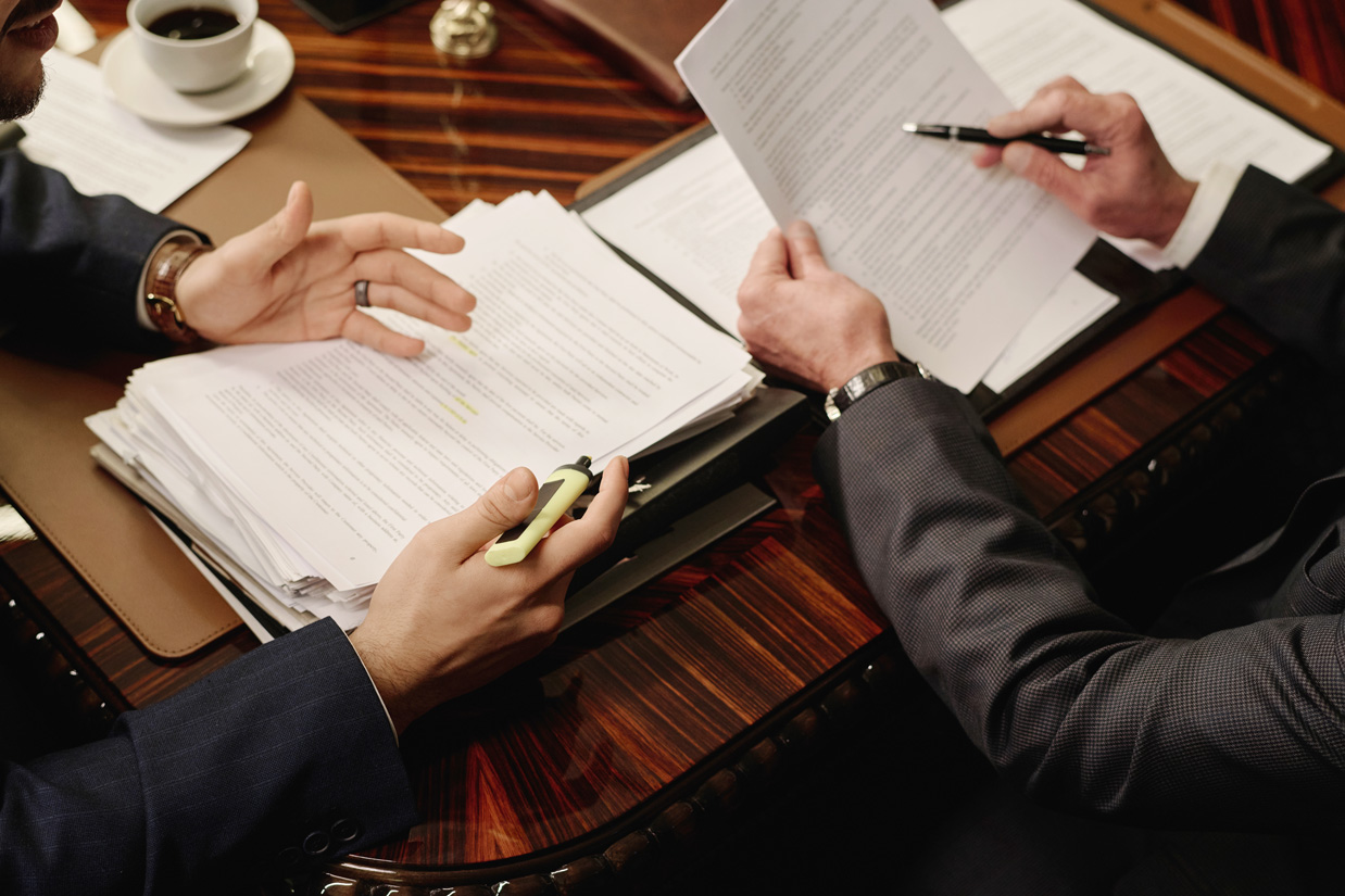 Law Laguna reviews the details of a business contract with Orange County Business owner