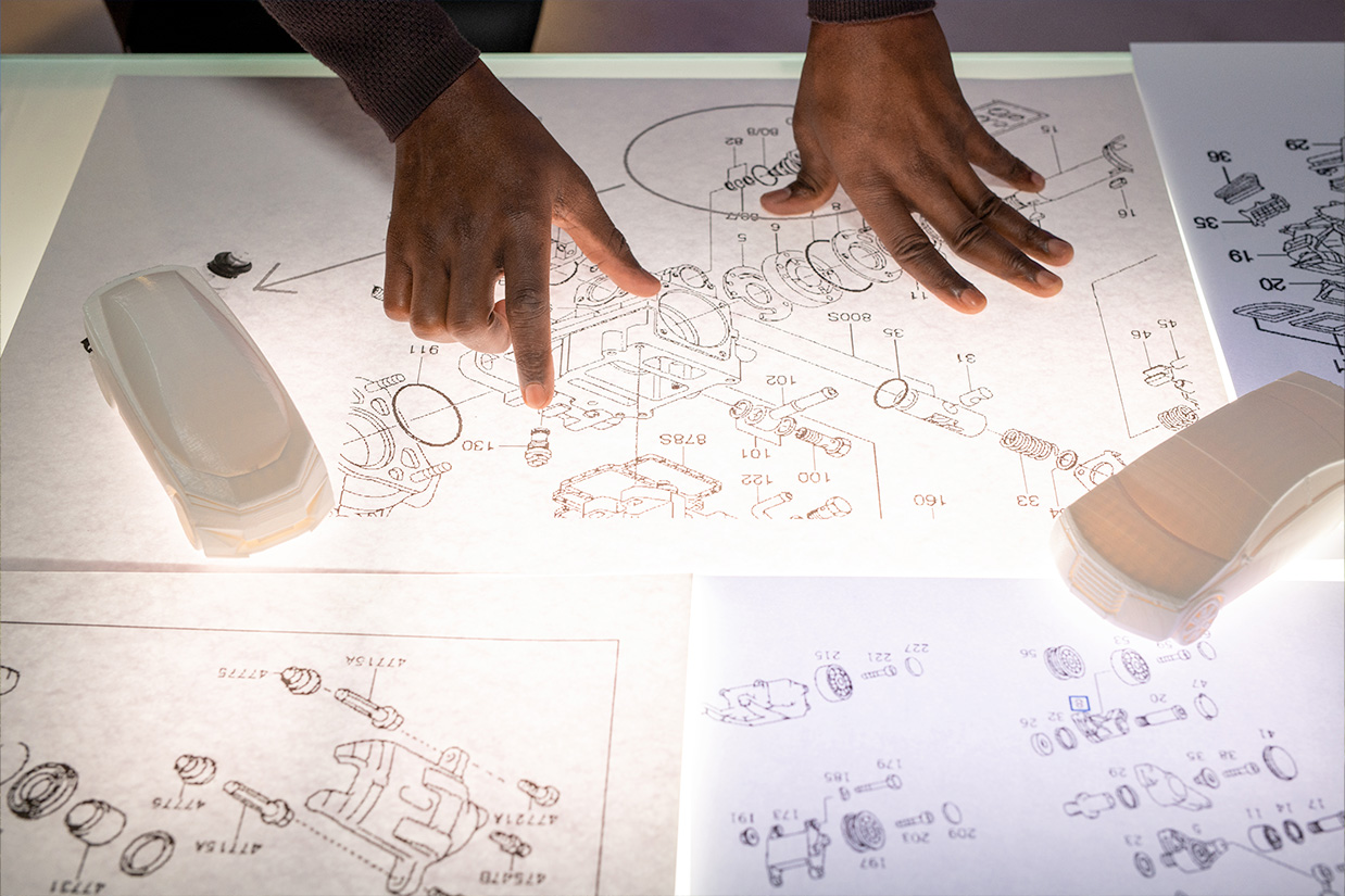 Law Laguna attorney meets with engineers to discuss the details of a patent application